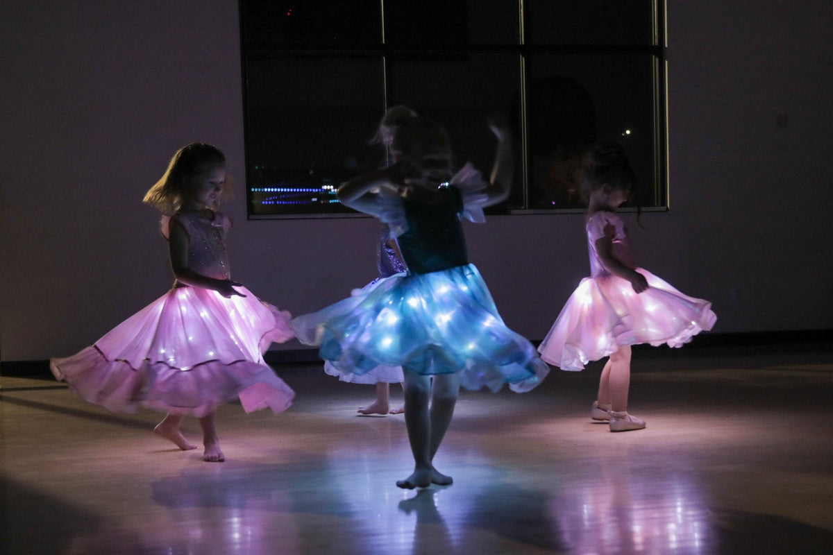 How It Works — girls in glowing dresses