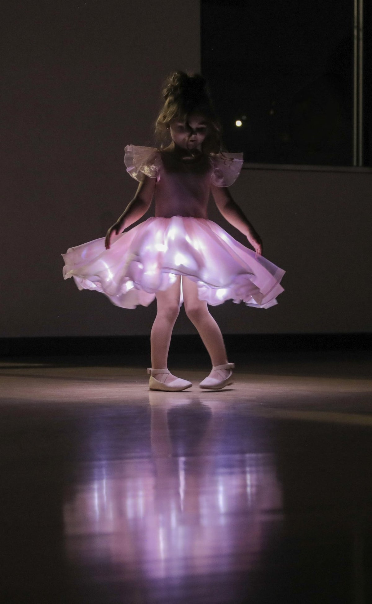 First Light in Blush glowing mid-spin