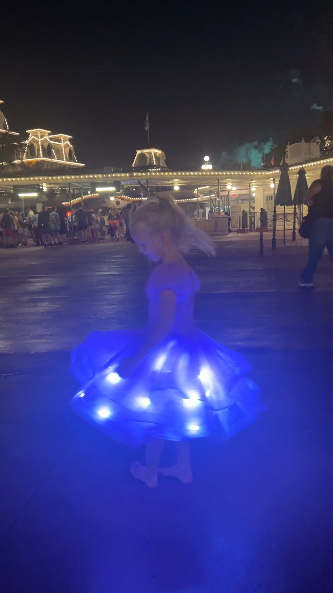 Moonbeam in Lavender glowing mid-spin at night