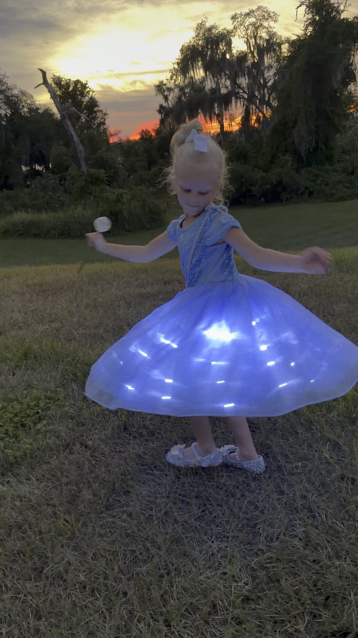 Starlit Ball in Celeste glowing mid-spin at sunset